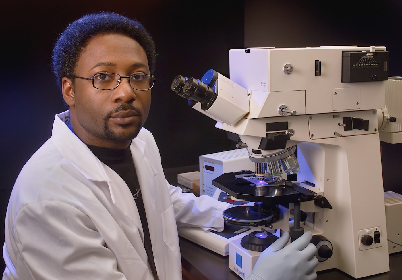Scientist carrying out detailed laboratory analysis